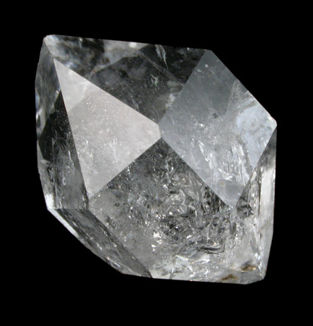 Clear Herkimer crystal on black, treated as a key-form image.